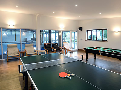 Well equipped games room adjoining large indoor heated swimming pool
