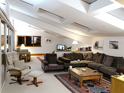 spacious lounge with additional seating and TV