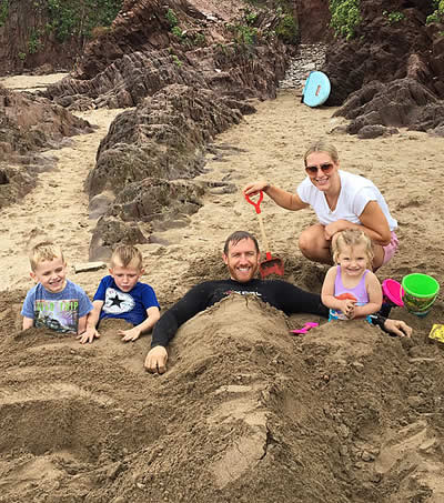 Family enjoying a day on the beach