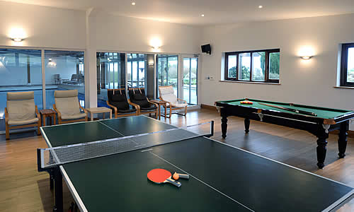 Large private indoor swimming pool and games room provide ample amusement for all the family at The Barn, Dartmoor